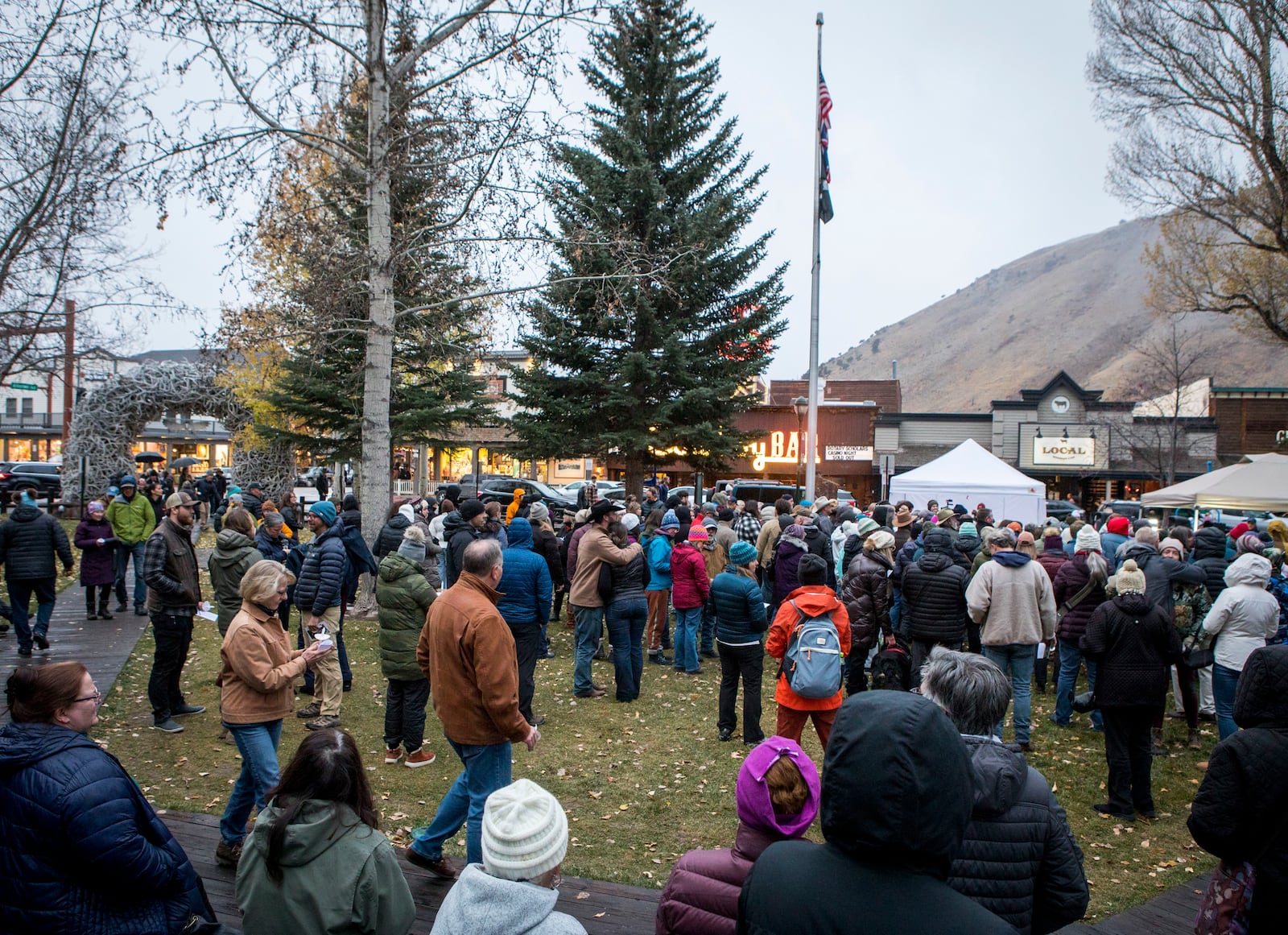 Mourners gather to celebrate the life of grizzly bear No. 399 at a candlelight vigil in Jackson, Wyo. on Nov. 2, 2024. (AP Photo/Amber Baesler)