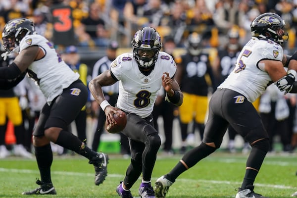 Baltimore Ravens quarterback Lamar Jackson scrambles against the Pittsburgh Steelers during the first half of an NFL football game, Sunday, Nov. 17, 2024, in Pittsburgh. (AP Photo/Matt Freed)