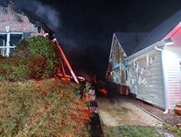 The blaze was so hot it began melting the siding of neighboring houses