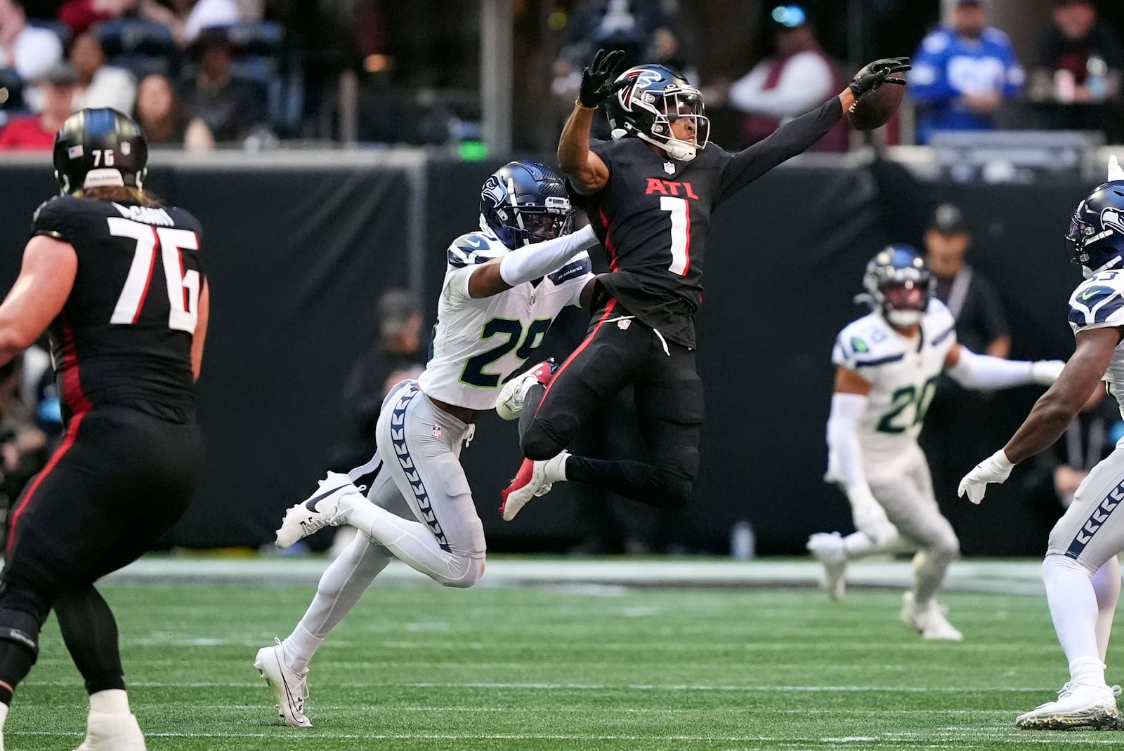 Atlanta Falcons wide receiver Darnell Mooney (1) can not make a catch as Seattle Seahawks cornerback Josh Jobe (29) defends during the first half of an NFL football game, Sunday, Oct. 20, 2024, in Atlanta. (AP Photo/ Brynn Anderson )