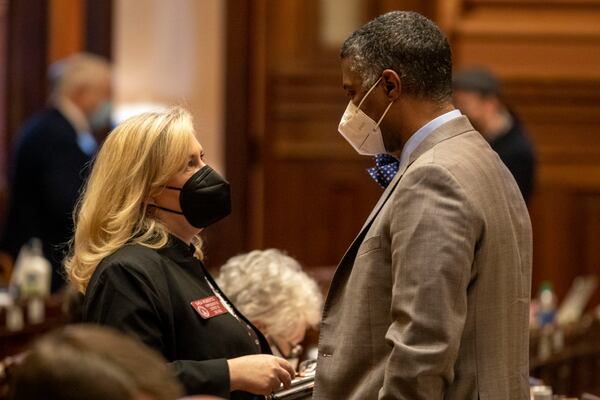 Opponents of legislation that would increase oversight of Georgia prosecutors, such as state Rep. Shea Roberts, shown speaking to House Minority Leader James Beverly, say there are already layers of accountability baked into the law, including oversight by the State Bar of Georgia and a little-used provision that allows the General Assembly to remove prosecutors. “Why are we spending taxpayer money to create another level of government when there are already provisions to address prosecutorial oversight?” Roberts asked. “This is dangerous territory.”(Alyssa Pointer / Alyssa.Pointer@ajc.com)