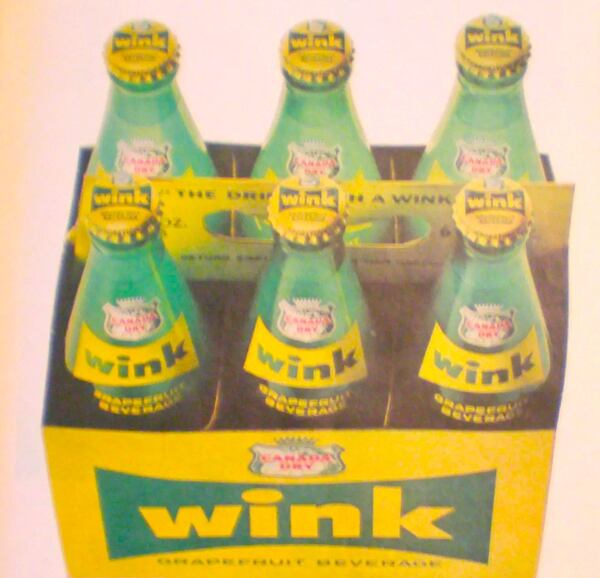 The soft drink was introduced in green glass bottles as “Wink, the Sassy One, from Canada Dry.”