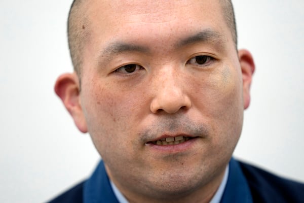 Yasunobu Yokokawa, a TEPCO staff, speaks during an interview with The Associated Press at the Fukushima Daiichi nuclear power plant, operated by Tokyo Electric Power Company Holdings (TEPCO), in Okuma town, northeastern Japan on Monday Feb. 20, 2025. (AP Photo/Eugene Hoshiko)