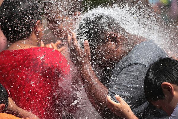 Children cool off in a Chicago fountain as temperatures climbed into the 90s with a heat index expected to reach as high as 115 degrees on July 19. The heat wave affected nearly two-thirds of the United States, where more than 195 million people experienced multiple days with temperatures above 90 degrees.