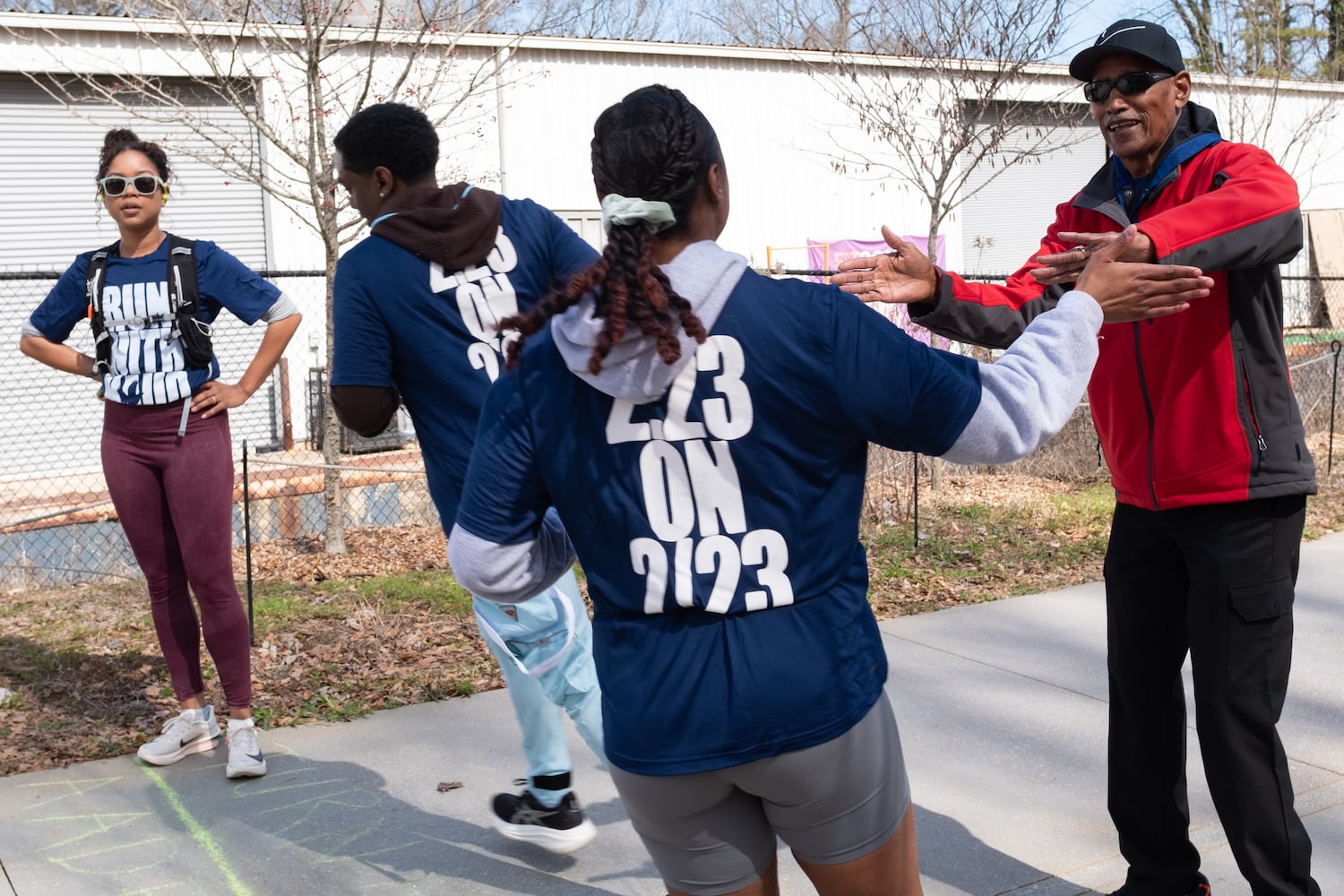 Bobby Sasberry, with South Fulton Running Partners, cheers on runners at the turn around of the 2.23 mile Ahmaud Arbery Day Run in Atlanta on Sunday, Feb. 23, 2025.   Ben Gray for the Atlanta Journal-Constitution