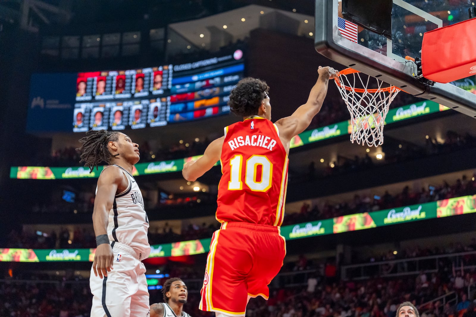 Atlanta Hawks forward Zaccharie Risacher (10) goes up for a layup during the first half of an NBA basketball game against the Brooklyn Nets, Wednesday, Oct. 23, 2024, in Atlanta. (AP Photo/Jason Allen)