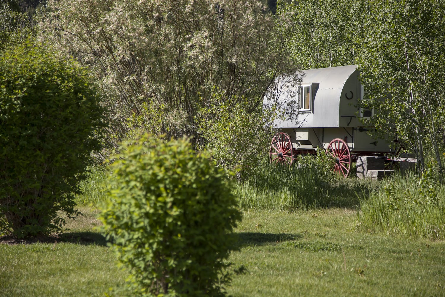 500-acre property has log cabins, mountain views