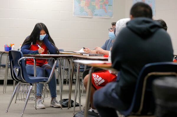 Student Laily Leung focuses on a dry erase board during Gwinnett County's Hispanic Mentoring Program summer camp at Meadowcreek High School on Wednesday, July 14, 2021. (Christine Tannous / christine.tannous@ajc.com)