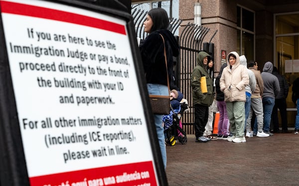 People line up outside of the Immigration and Customs Enforcement Atlanta field office on Monday.