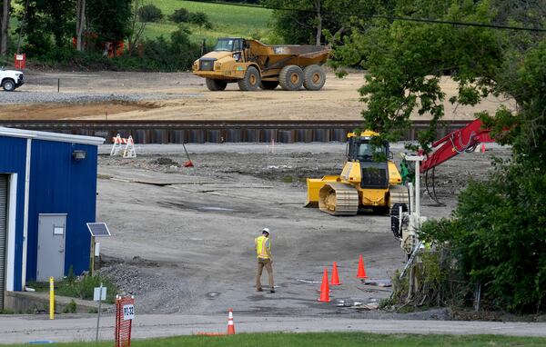 Cleanup and remediation continues on the site of the Feb. 3 Norfolk Southern freight train derailment, Friday, July 14, 2023, in East Palestine. (Matt Freed for the Atlanta Journal Constitution)