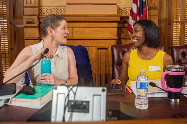 State Election Board members Sara Tindall Ghazal (left) and Janelle King speak during a State Election Board meeting in Atlanta on July 9, 2024. (Ziyu Julian Zhu/AJC)