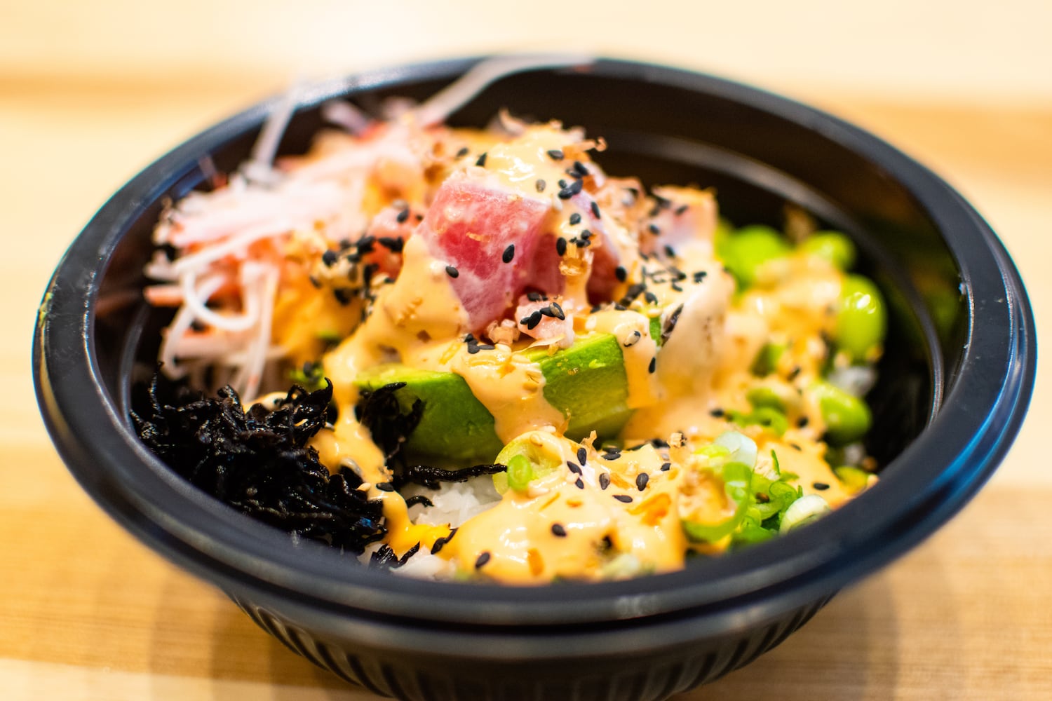 A poké bowl topped with the PokéSpot's signature avocado boat. CONTRIBUTED BY HENRI HOLLIS