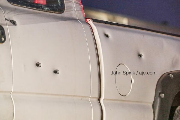 Bullet holes were seen Tuesday morning in the side of a pickup truck on the scene of a trooper-involved shooting outside Norcross.