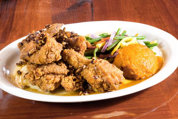 The honey pecan fried chicken at the Pirates' House gets an extra layer of crunch, salt and sweetness from a drizzle of honey pecan sauce. (Courtesy of the Pirates' House)