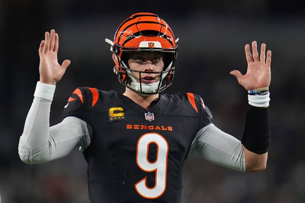 Cincinnati Bengals quarterback Joe Burrow gestures to fans during the first half of an NFL football game against the Dallas Cowboys, Monday, Dec. 9, 2024, in Arlington, Texas. (AP Photo/Julio Cortez)