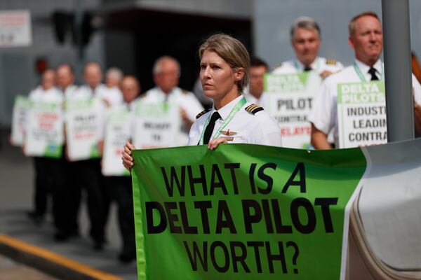 Delta Air Lines pilots hit the picket line demanding working better conditions on Thursday, June 30, 2022. The pilots are members of the Delta Airlines Pilots Association, pushing for a new labor contract among their demands. Miguel Martinez / Miguel.martinezjimenez@ajc.com