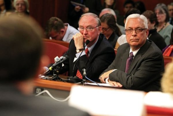 University System Chancellor Hank Huckaby, center, and Technical College System of Georgia Commissioner Ron Jackson listen to a member of the House Higher Education Committee in a session of the General Assembly.