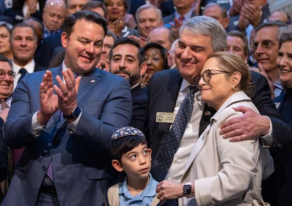 State representatives John Carson, R-Marietta, (right) and Esther Panitch, D-Sandy Springs, are recognized by Gov. Brian Kemp before he signs the antisemitism bill at the Capitol in Atlanta on Jan. 31, 2024.  (Arvin Temkar/arvin.temkar@ajc.com)