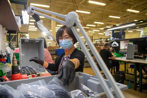 Fischer Connectors employee Jaeim Lanore wears a mask while crimping cables during her shift at the company's manufacturing plant in Alpharetta, Monday, August 16, 2021. (Alyssa Pointer/Atlanta Journal Constitution)