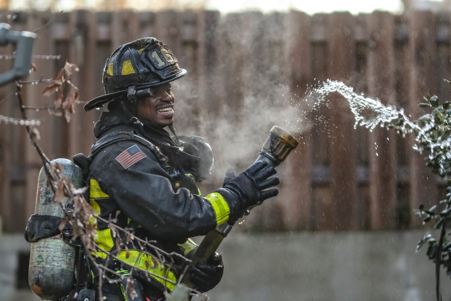 Atlanta firefighter, Coleman Lynn is surrounded by his breath in arctic temperatures Wednesday morning, Jan. 17, 2024 where a fire destroyed an abandoned house in northwest Atlanta, according to officials. Crews were dispatched around 8 a.m. to the vacant one-story home in the 600 block of Jett Street near Sunset Avenue, according to Atlanta fire Capt. Raymondo Hampton. Firefighters took a defensive attack on the fully involved residence until they could get to a point where they could conduct a search inside. No one was found during the search. “We were able to get a good stop on it pretty quick,” Hampton told The Atlanta Journal-Constitution. While the cause and origin of the fire is under investigation, Hampton said he suspects it was just people trying to stay warm. “It’s cold temperatures outside right now, we’re at about 14 degrees,” he said. The low temps were an obstacle for firefighters, who Hampton said typically bring extra equipment and clothes during similar operations as a precaution. He noted it was the second time fire crews responded to the home in recent months. No injuries were reported Wednesday. (John Spink / John.Spink@ajc.com)