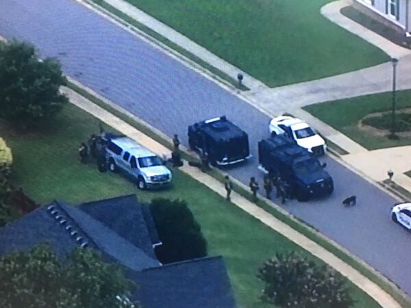 A former Gwinnett County police officer was arrested Friday after a SWAT standoff at his home in Bethlehem, authorities said.