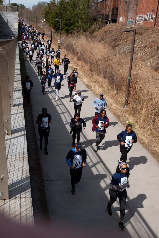 Runners make their way along the Atlanta Beltline during the 2.23 mile Ahmaud Arbery Day Run in Atlanta on Sunday, Feb. 23, 2025, to mark the anniversary of the day Arbery was killed while out on a run near Brunswick.   Ben Gray for the Atlanta Journal-Constitution