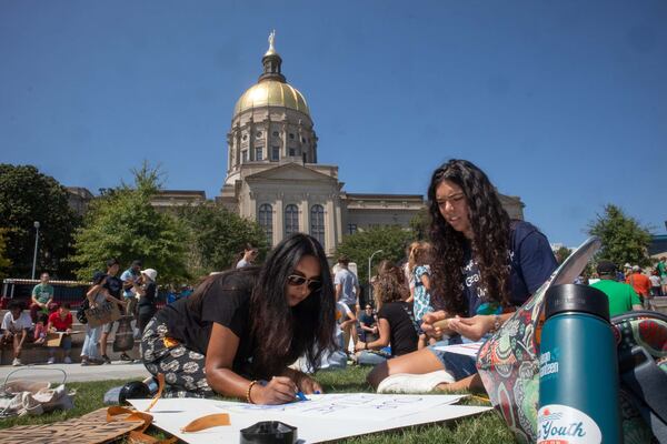 Farida Testa and her daughter Hannah make signs at Liberty Plaza during the Climate Reality Strike March Friday, September 20, 2019. 