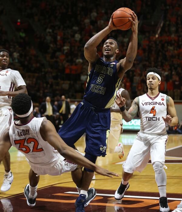  Georgia Tech's Josh Okogie (5) drives to the basket and is called for an offensive foul against Virginia Tech's Zach LeDay (32) during the first half of an NCAA college basketball game in Blacksburg Va., Wednesday, Jan. 18 2017. (Matt Gentry/The Roanoke Times via AP)