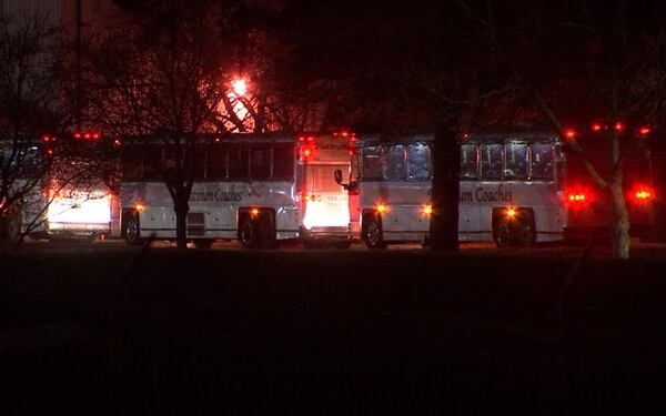 The first  quarantined passengers from the Grand Princess cruise ship arrive at Dobbins Air Reserve Base in Marietta early Wednesday morning.