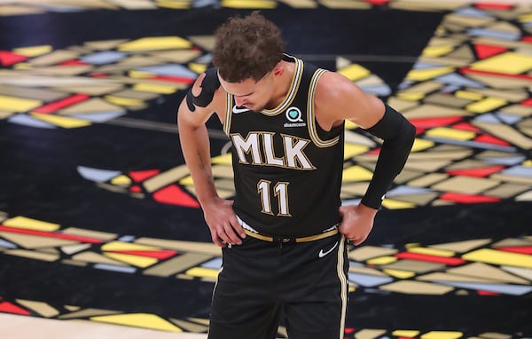 Hawks guard Trae Young takes a moment on the court during Game 4 of the Eastern Conference semifinals against the Philadelphia 76ers Monday, June 14, 2021, in Atlanta. (Curtis Compton/Curtis.Compton@ajc.com)