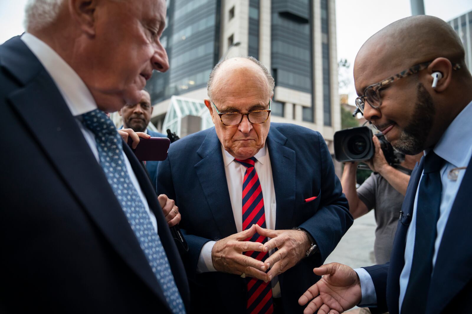 Rudy Giuliani, center, Donald Trump’s former personal lawyer, arrives at the Fulton County Courthouse for a grand jury appearance in Atlanta, Aug. 17, 2022. Giuliani urged Trump to follow through with a plan to simply declare victory in the 2020 election. (Nicole Craine/The New York Times)