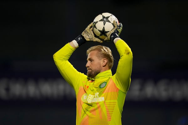 Celtic goalkeeper Kasper Schmeichel catches the ball during the Champions League opening match between Dinamo Zagreb and Celtic at Maksimir Stadium in Zagreb, Croatia, on Tuesday, December 10, 2024. (AP Photo/Darko Vojinovic)