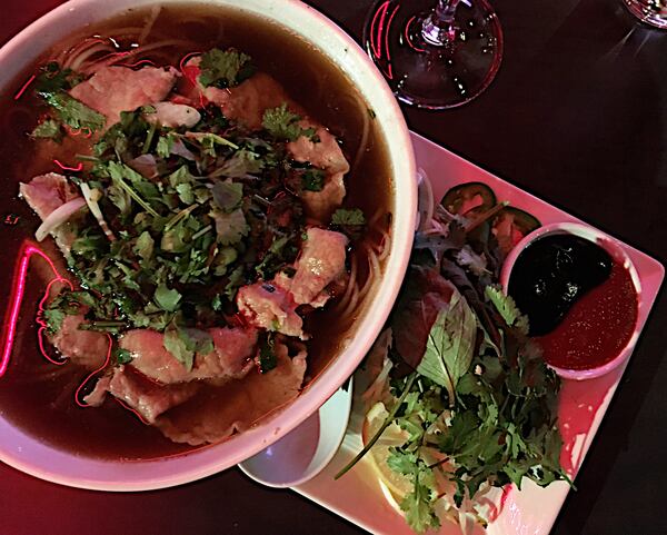  The beef pho served at Co is accompanied with traditional garnishes of herbs, sprouts, and sliced jalapenos. Credit: Wyatt Williams