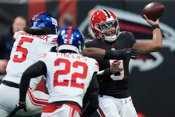 Atlanta Falcons quarterback Michael Penix Jr. (9) throws the ball in the first half of an NFL football game against the New York Giants in Atlanta, Sunday, Dec. 22, 2024. (AP Photo/John Bazemore)