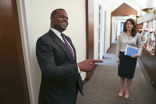 Former Mayor Kasim Reed (left) and his then-press secretary, Jenna Garland (right), in 2015. Garland’s text messages instructing another city employee to delay an open records are the subject of a GBI criminal investigation. JOHN SPINK / JSPINK@AJC.COM