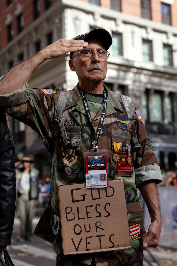 Vietnam War veteran Jose Alvarez, 72, salutes during the national anthem during the annual Veterans Day Parade, Monday, Nov. 11, 2024, in New York. (AP Photo/Adam Gray)