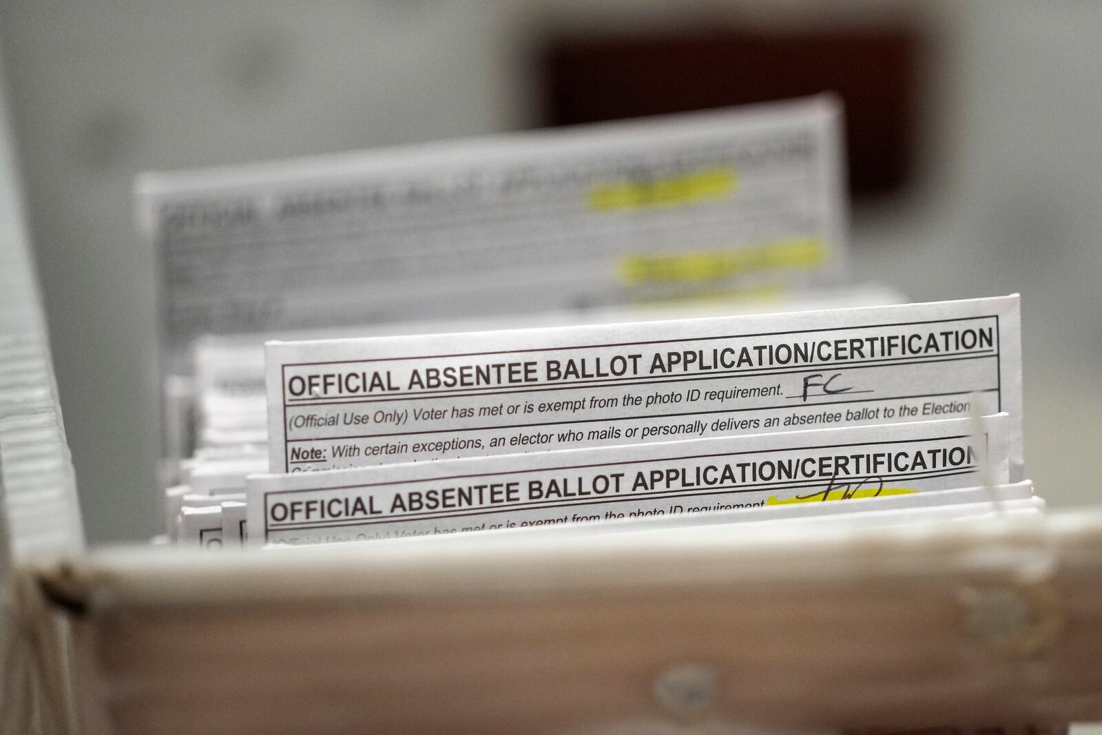 FILE - Absentee ballots are seen during a count at the Wisconsin Center for the midterm election on Nov. 8, 2022, in Milwaukee. (AP Photo/Morry Gash, File)