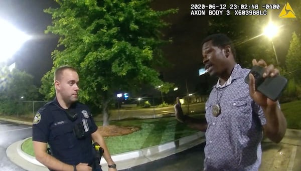 This screen grab taken from body camera video provided by the Atlanta Police Department on June 12, 2020, shows Rayshard Brooks, right, speaking with Officer Garrett Rolfe in the parking lot of a Wendy's restaurant, prior to being fatally shot by Rolfe. (Atlanta Police Department/Zuma Press/TNS)