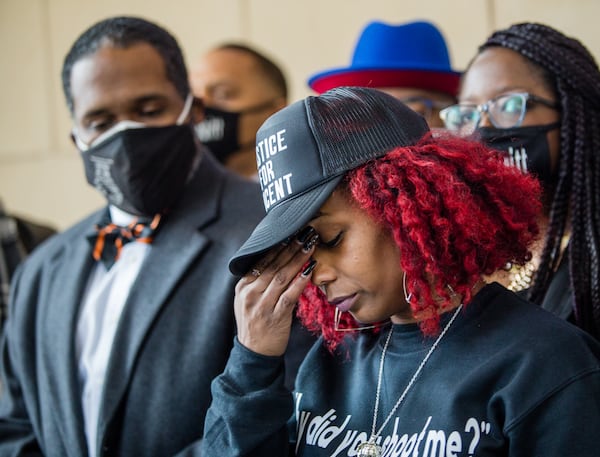 Vincent Truitt's mother, Venethia Cook-Lewis (right), and attorney Gerald Griggs announced plans to file a $50 million lawsuit.