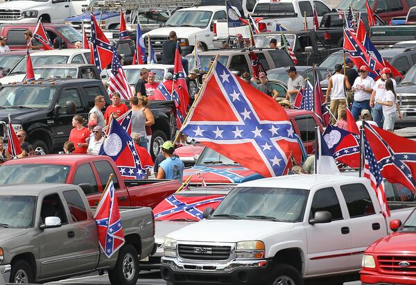 Hundreds of Confederate flag enthusiasts rallied at Stone Mountain Park Aug. 1, attracting a handful of counter protesters.