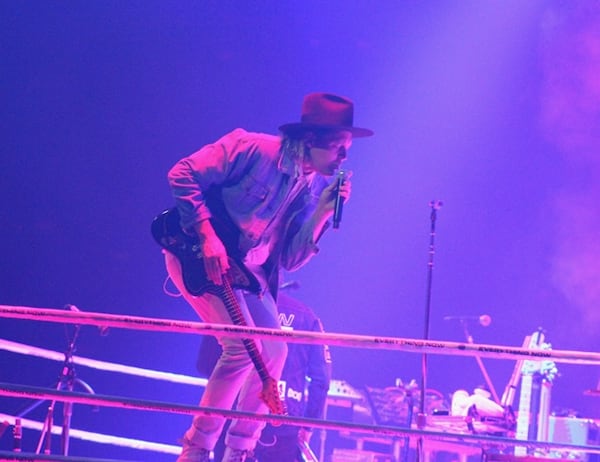  Win Butler often hopped atop cubes on the stage floor so fans could get a better look during Arcade Fire's Sept. 21, 2017 concert at Infinite Energy Arena. Photo: Melissa Ruggieri/AJC