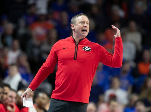 Georgia head coach Mike White reacts during the first half of an NCAA college basketball game against Florida, Saturday, Jan. 25, 2025, in Gainesville, Fla. (AP Photo/Alan Youngblood)