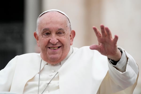 Pope Francis waves as he leaves after his weekly general audience in St. Peter's Square at The Vatican, Wednesday, Nov.20, 2024. (AP Photo/Gregorio Borgia)