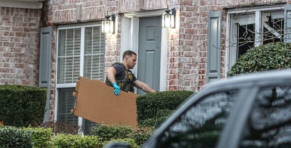 FBI agents could be seen taking in evidence boxes while deputies with long guns watched the perimeter. 
