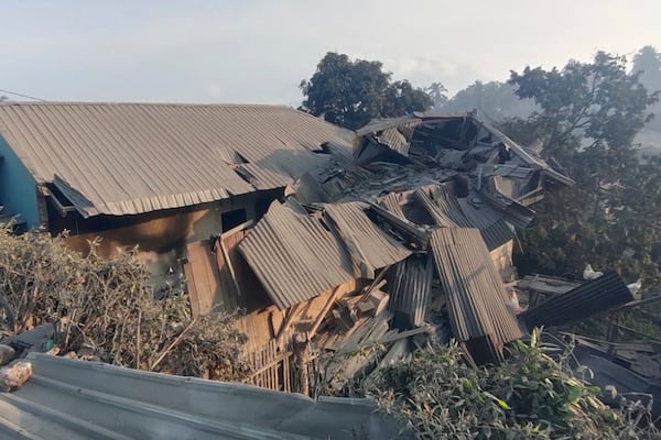 In this photo released by the Indonesian National Search and Rescue Agency (BASARNAS), a house is seen damaged by the eruption of Mount Lewotobi Laki-Laki in East Flores, Indonesia on Monday, Nov. 4, 2024. (BASARNAS via AP)