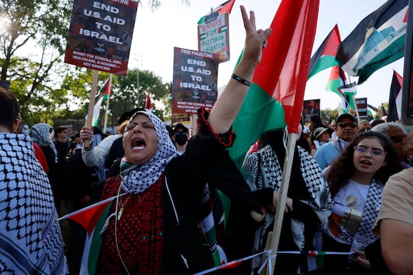 Gawahir Kamil from Georgia chants during a demonstration near the  Democratic National Convention in Chicago.