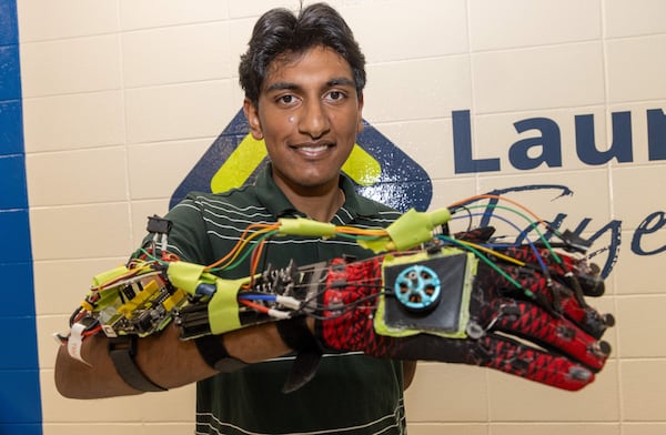 Aadi Vaidya, shows on a glove he has developed that he believes will help reduce tremors in people with Parkinson's disease. His grandfather who lives in India has Parkinson's. He's won recognition for his glove, which is not the first one out there dealing with this topic. He is learning the skills to be an entrepreneur, inventor from Launch Fayette. PHIL SKINNER FOR THE ATLANTA JOURNAL-CONSTITUTION