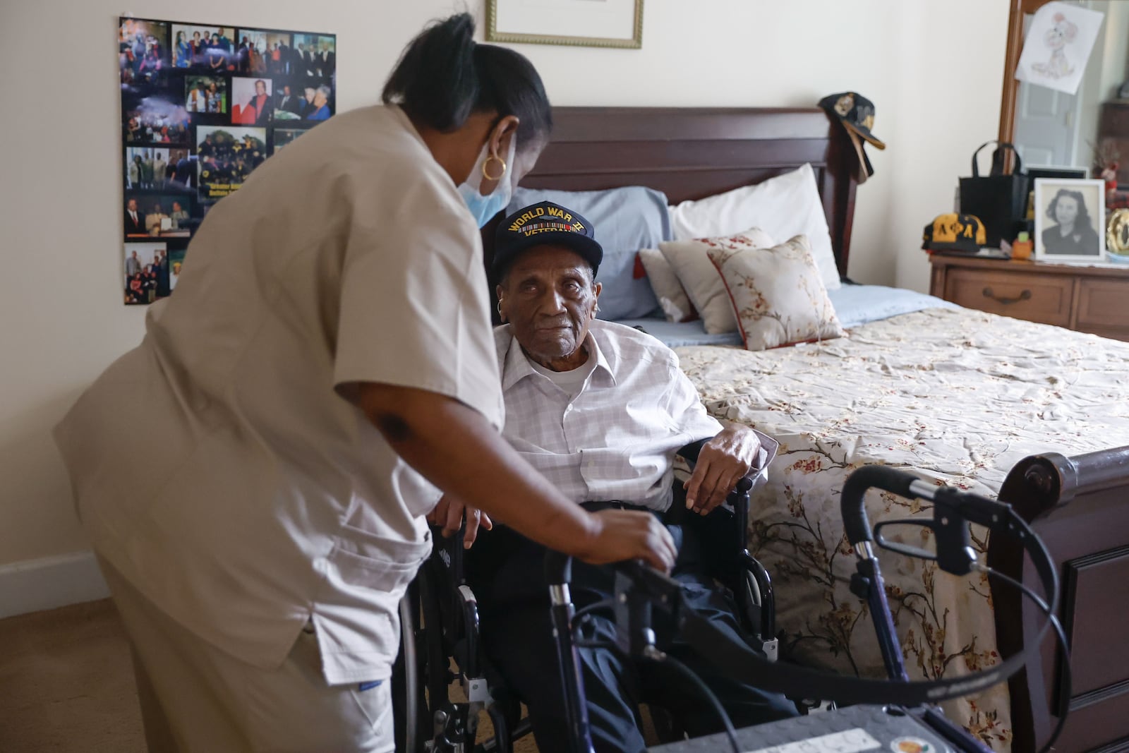 Valeria Myrick (left), the caregiver for William Robie, 104, talks to Robie before taking him to lunch at Summerset Assisted Living in Atlanta on Friday, Sept. 13, 2024. (Natrice Miller/AJC)