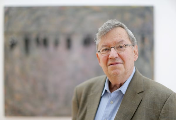 Art collector Bill Arnett, standing in front of Thornton Dial’s “Green Pastures: The Birds That Didn’t Learn How to Fly” at the High Museum in May. (Bob Andres / bandres@ajc.com)