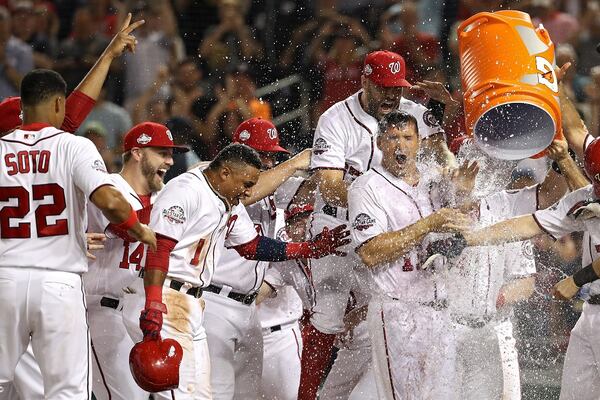 Ryan Zimmerman of the Washington Nationals celebrates with teammates after hitting a walk-off two-run home run against the Philadelphia Phillies during the ninth inning at Nationals Park on August 22, 2018 in Washington, DC. (Photo by Patrick Smith/Getty Images)